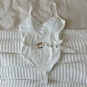 kittenish white one piece with belt NWT